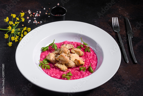 Delicious risotto with roasted pieces of chicken fillet. Risotto with chicken pieces. 