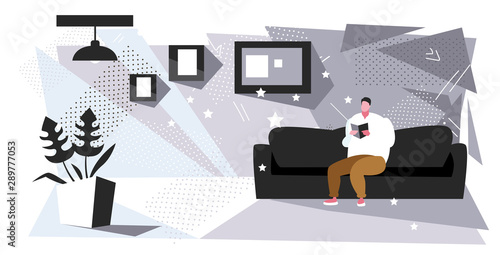 fat man sitting on couch reading book obese guy relaxing with textbook on sofa education obesity concept modern living room interior sketch full length horizontal