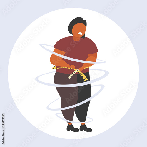 fat obese woman measuring her waistline sad african american overweight girl using tape measure weight loss obesity concept flat full length