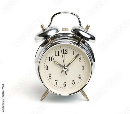 Old Silver vintage alarm clock isolated on white background. Clipping path include in this image.