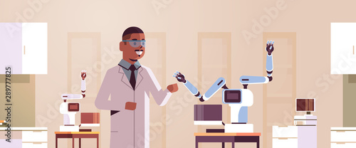 male scientist near industrial robotic arm man in uniform with robot manipulator smart medical machine automatic technology concept modern laboratory interior portrait horizontal flat