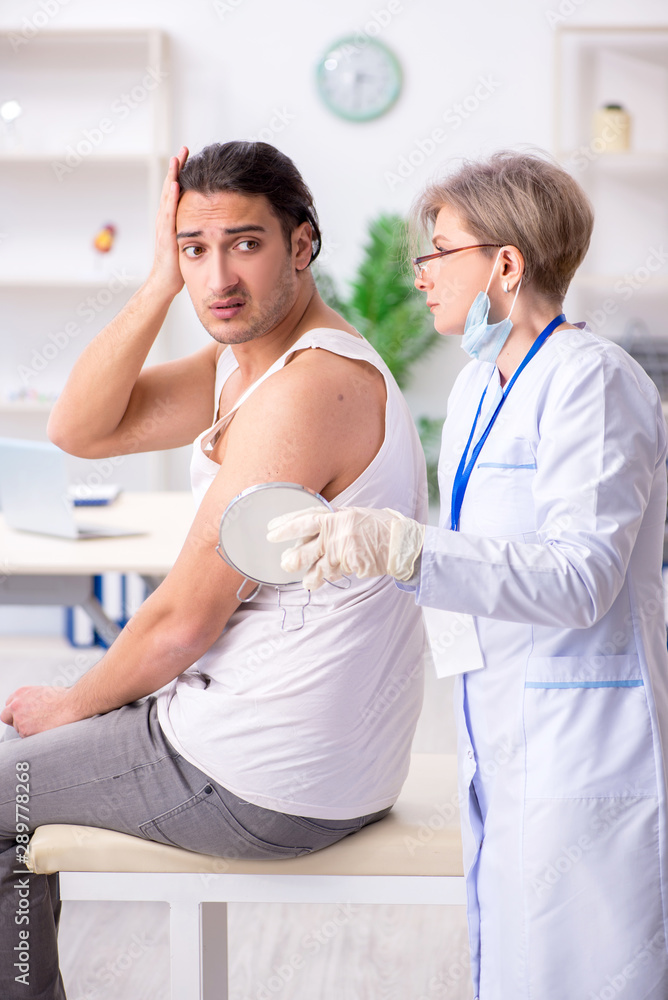 Fototapeta premium Young patient visiting doctor in hospital