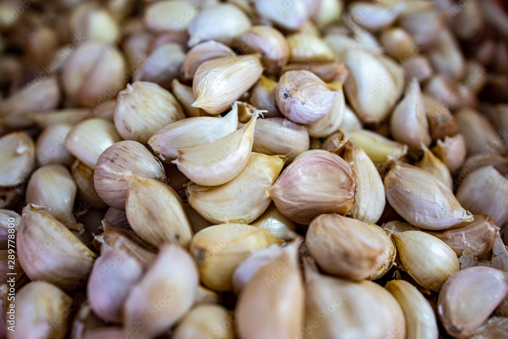 A group of dried garlic bulb as food ingredient for cooking A group of dried garlic bulb as food ingredient for cooking