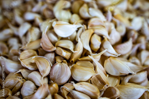 A group of  dried garlic bulbs