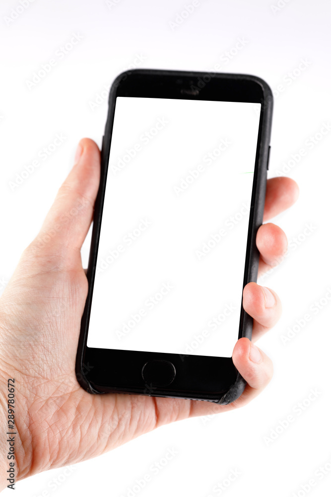 Touch screen smartphone in a hand.Man holding smartphone with blank screen on white background, closeup of hand.