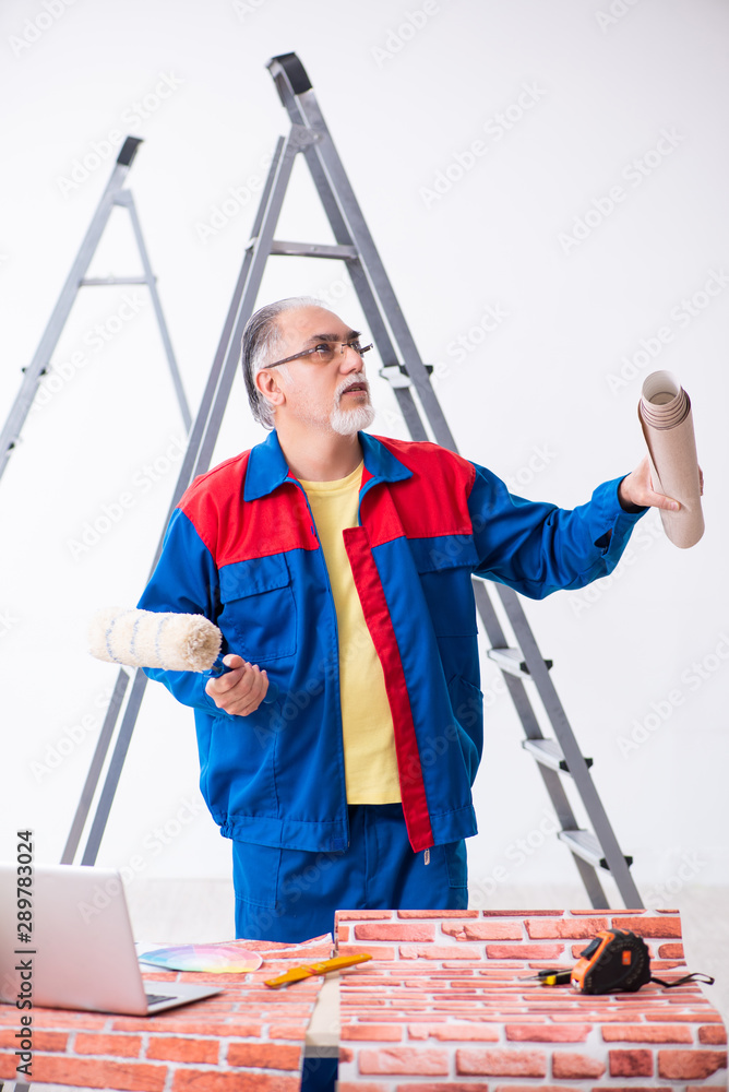 Old contractor doing renovation at home Old contractor doing renovation at home