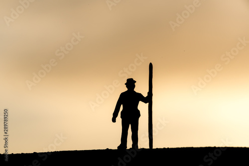 Abstract,silhouette Model people mining on sky sunset background. © pinglabel