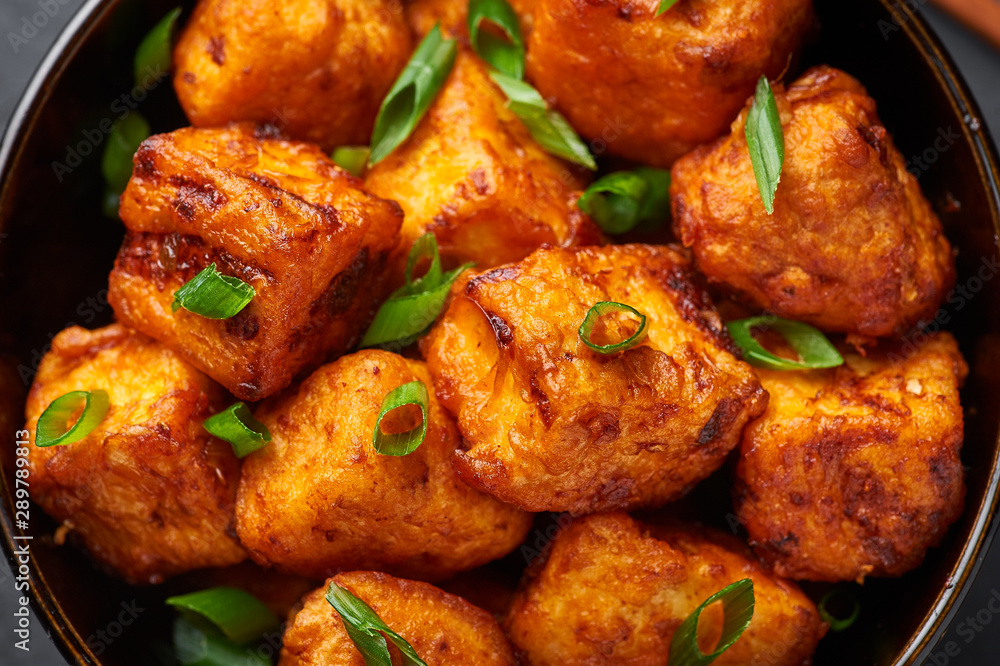 Paneer Manchurian or Paneer 65. Paneer Manchurian is Indian Chinese cuisine dish with panner cheese, tomatoes, onion, soy sauce. Close Up Paneer Manchurian or Paneer 65. Paneer Manchurian is Indian Chinese cuisine dish with panner cheese, tomatoes, onion, soy sauce. Close Up