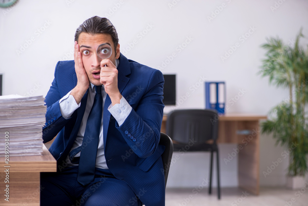 Young handsome businessman working in the office Young handsome businessman working in the office