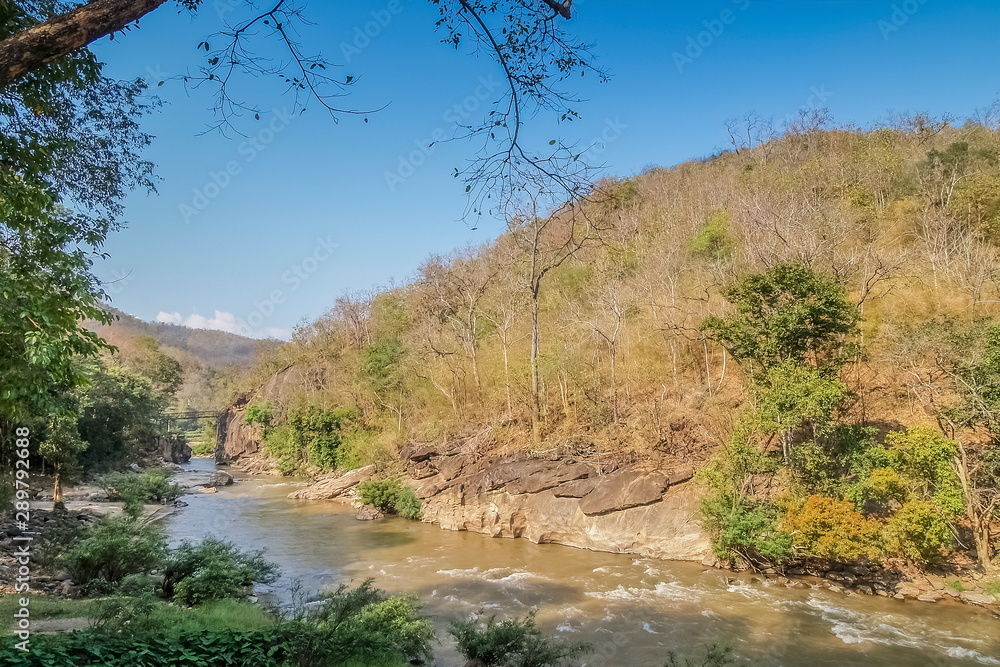 view of river flowing around with many arch rocks and green forest with the hills and blue sky background, Ob Luang National Park, Chiang Mai, northern of Thailand. view of river flowing around with many arch rocks and green forest with the hills and blue sky background, Ob Luang National Park, Chiang Mai, northern of Thailand.