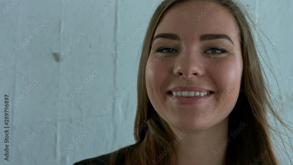 Young pretty attractive brunette woman smiling at the camera. Close Up Potrait shot. Young pretty attractive brunette woman smiling at the camera. Close Up Potrait shot.