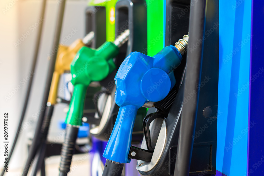Detail of a fuel pump filling in a gas station, Vehicle fueling facility. Detail of a fuel pump filling in a gas station, Vehicle fueling facility.