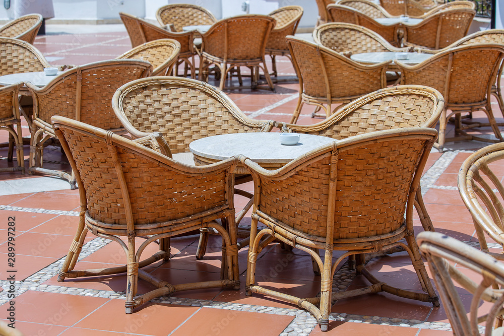 Rattan table and chairs in beach cafe next to the red sea in Sharm el Sheikh, Egypt