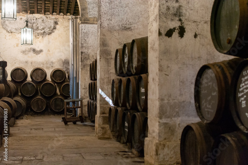 Fototapeta Production of fortified jerez, xeres, sherry wines in old oak barrels in sherry