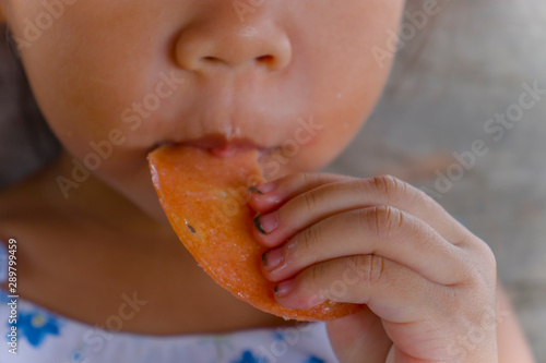 Children eating food with dirty hand and dirt lodged in the nails. healthcare concept.