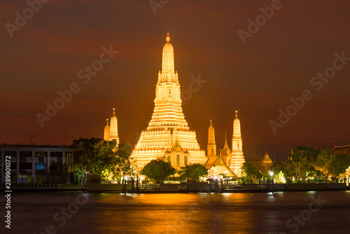 View of the main prang of Wat Arun Buddhist Temple in night lighting. Bangkok, Thailand © sikaraha