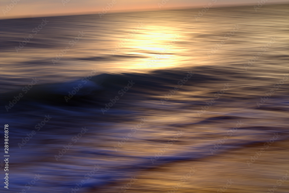 sunset over the sea,wave,motion,reflection,nature,summer,light,sunrise,sunlight