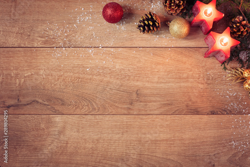Christmas Background With Red Candles, Golden Cones And Sparkle Balls. Top View, Flat Lay. Winter Holidays Wooden Backdrop With Copy Space For Text