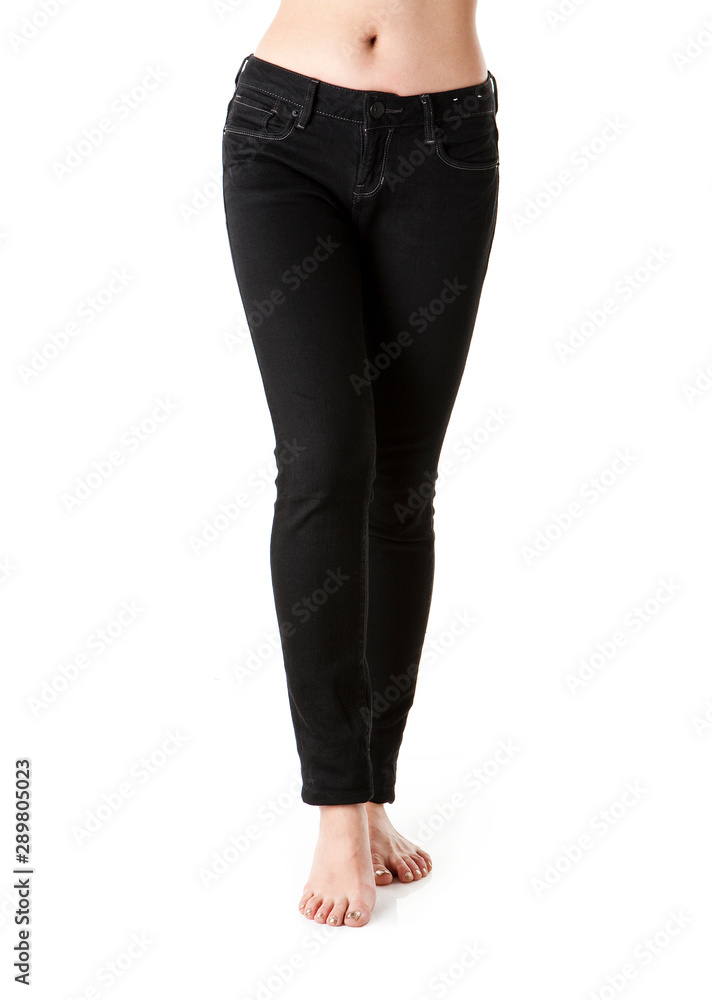 Image of woman legs wearing black jeans. Image of woman legs wearing black jeans.