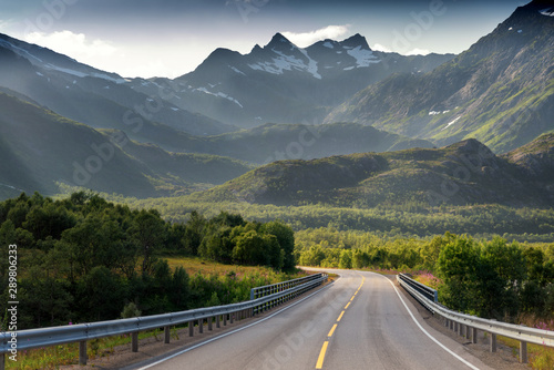 Highway in the mountains on the Loften Islands in Norway, beautiful landscape, sunset light