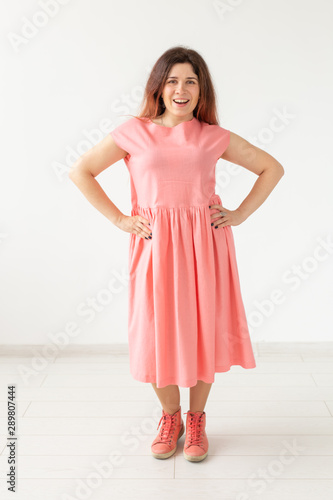 Wallpaper Mural people, fashion and design concept - young woman posing in rose dress on white background. Torontodigital.ca