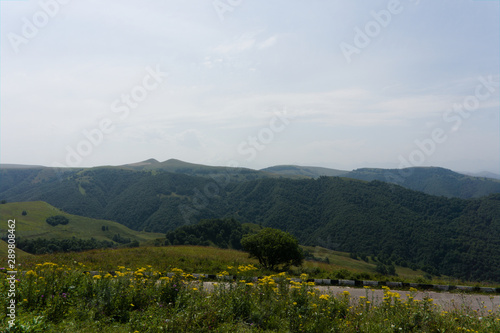 Fototapeta Naklejka Na Ścianę i Meble -  Lush green lawns meadows and mountains above 2000 m on the gumbashi pass in the northern caucasus between dombay and kislowodsk, raw original picture