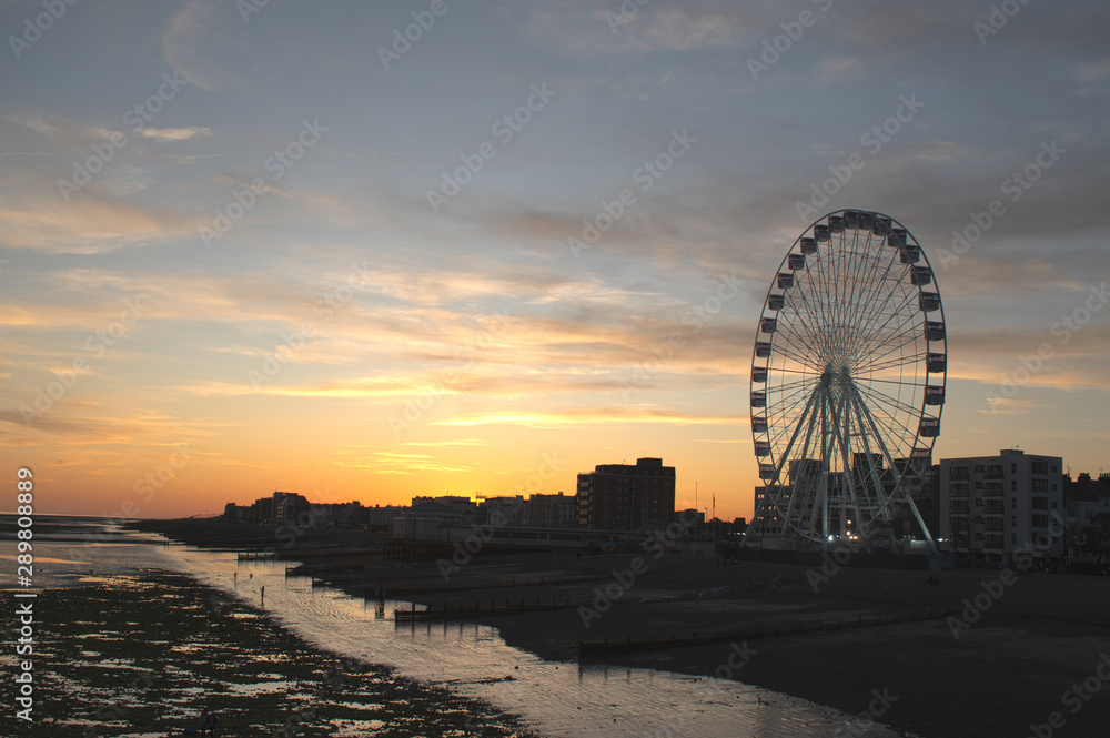 A beautiful sunset on Worthing Seafront in England with the Observation Wheel in view.