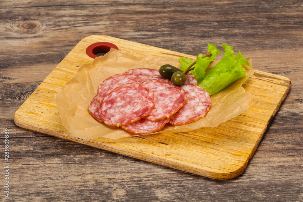 Spanish Salchichon sausage with salad Spanish Salchichon sausage with salad