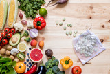 Modern composition of fresh healthy vegetables and fruits on the wooden table in the kitchen. Healthy detox and balance diet. Lifestyle. Vegetarian vegan background. Zero waste. Top view. Copy space.