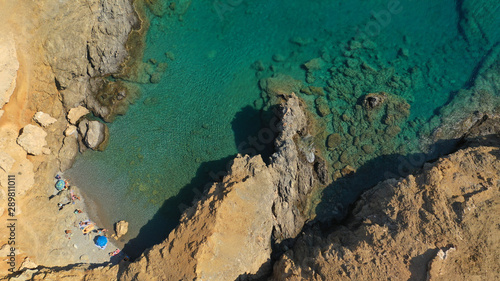 Aerial drone photo of emerald secluded crystal clear sea rocky cove of Ble limanaki or Blue Harbour in famous island of Astypalaia, Dodecanese, Greece