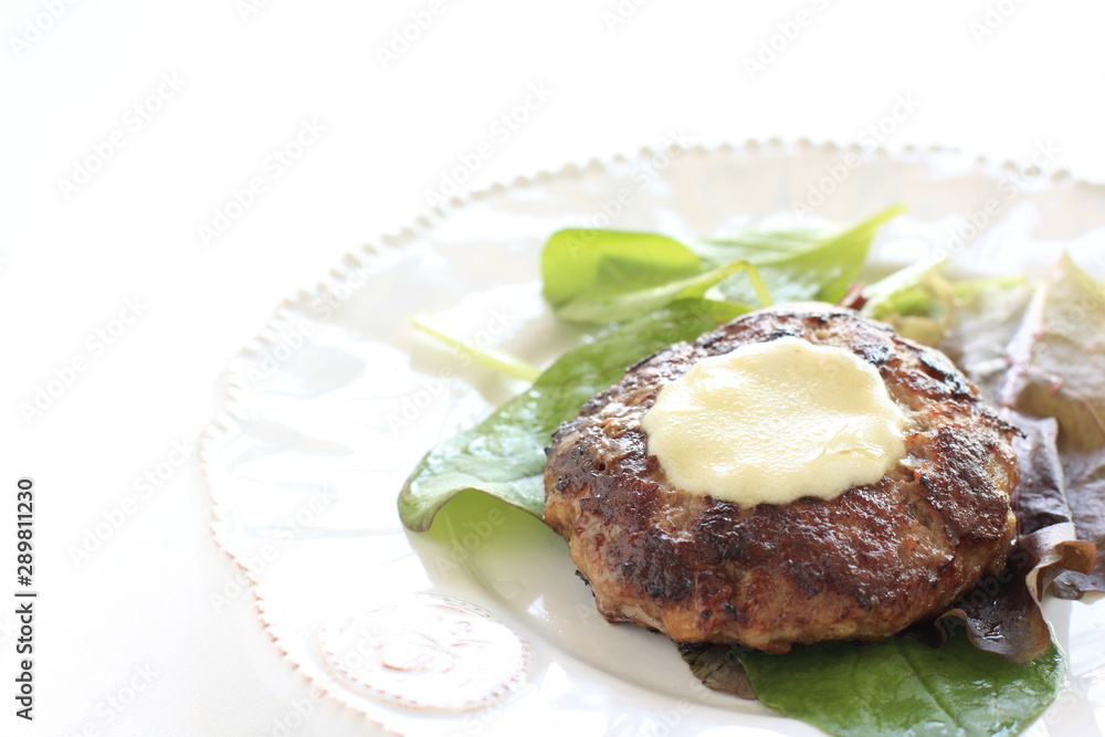 Cheese burger on baby leaf vegetable salad Cheese burger on baby leaf vegetable salad