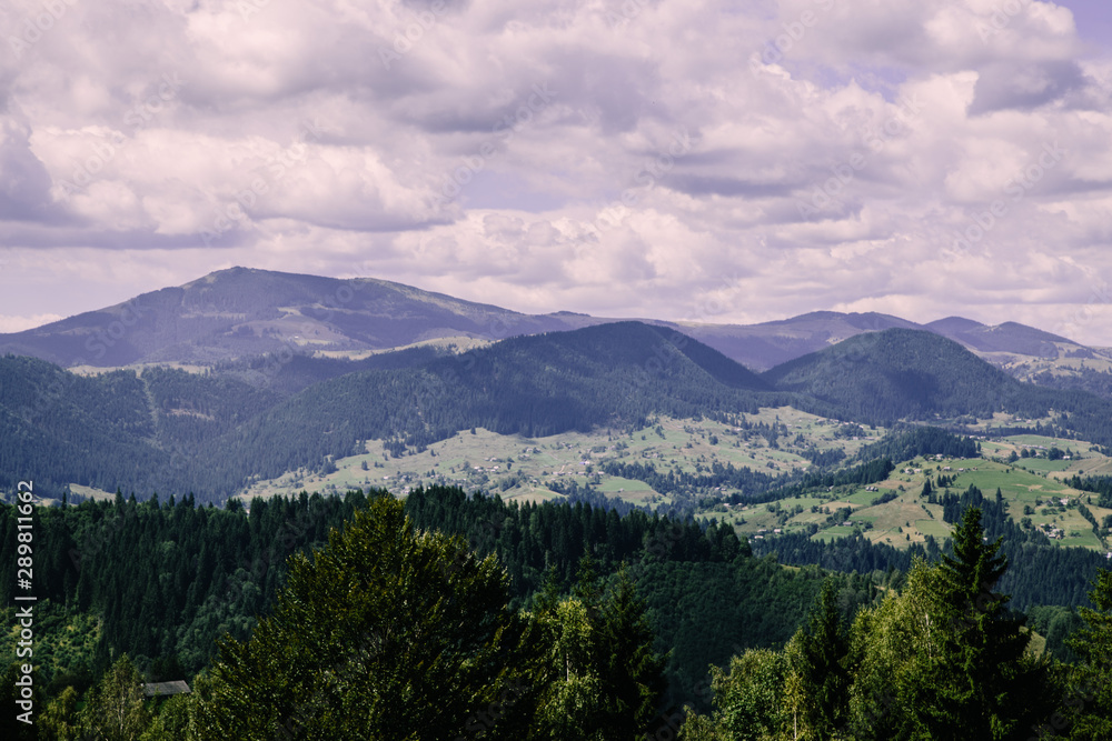 Fototapeta premium Mountain village landscape in the wild Ukrainian Bukovyna area