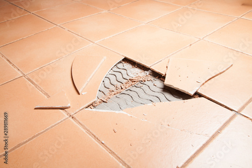 Broken, tenting, missing, cracked, floor tiles