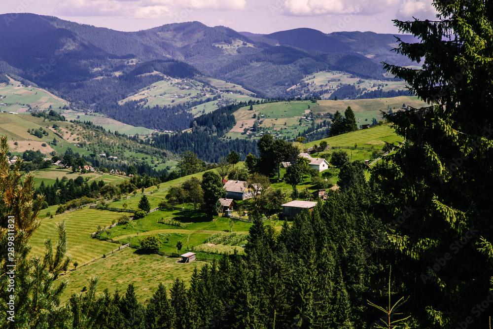 Naklejka premium Mountain village landscape in the wild Ukrainian Bukovyna area