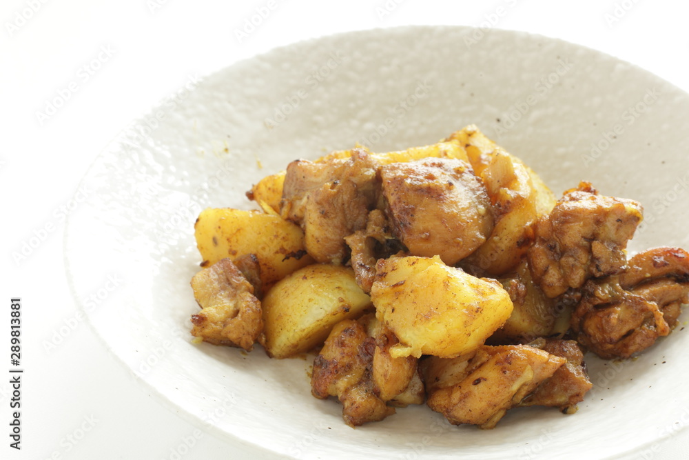 Potato and chicken stir fried with curry Potato and chicken stir fried with curry