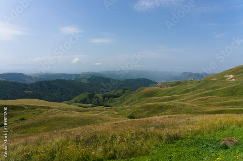 Lush green lawns meadows and mountains above 2000 m on the gumbashi pass in the northern caucasus between dombay and kislowodsk  raw original picture
