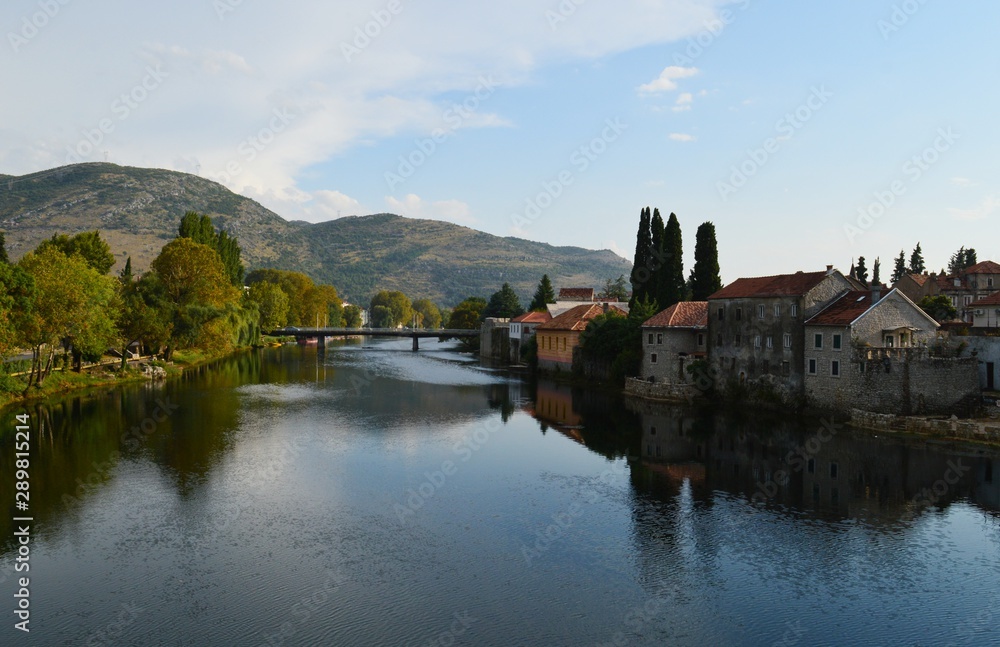 a reflection of the houses in the river