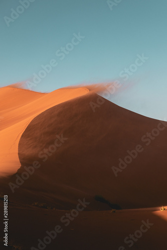 Sand blowing off a Sand Dune in the Desert 