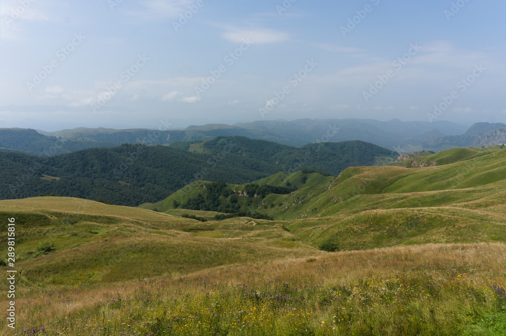 Lush green lawns meadows and mountains above 2000 m on the gumbashi pass in the northern caucasus between dombay and kislowodsk, raw original picture