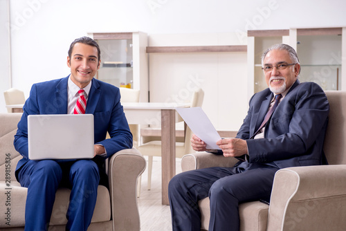 Two businessman discussing business in office © Elnur