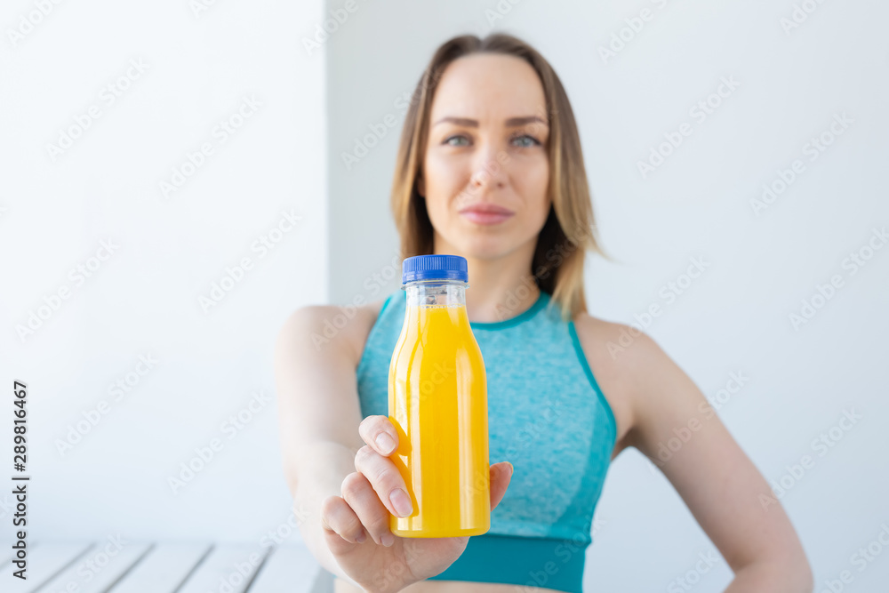 Healthy lifestyle, diet and vitamins - fitness woman with juice close-up Healthy lifestyle, diet and vitamins - fitness woman with juice close-up