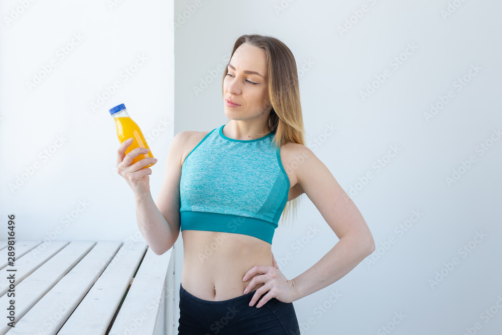 Healthy lifestyle, diet and vitamins - fitness woman with juice. Healthy lifestyle, diet and vitamins - fitness woman with juice.