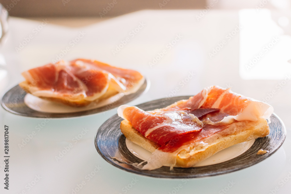 delicious homemade toast with serrano ham delicious homemade toast with serrano ham