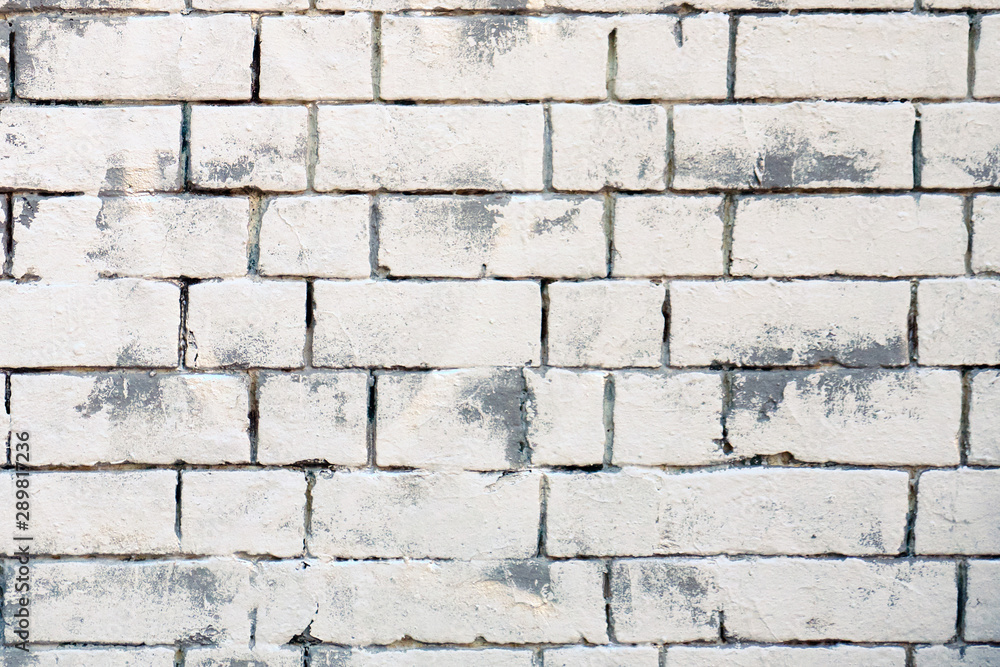 Background of retro brick wall. Texture of white brickwork. Bricks painted white and gray background. Background of retro brick wall. Texture of white brickwork. Bricks painted white and gray background.