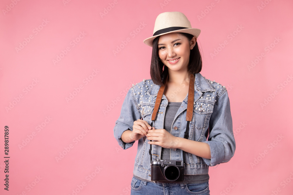 Tourist woman in summer casual clothes.Asian Smiling woman .Passenger traveling abroad to travel on pink background.Asian woman going to summer vacation.Travel trip funny. Tourist woman in summer casual clothes.Asian Smiling woman .Passenger traveling abroad to travel on pink background.Asian woman going to summer vacation.Travel trip funny.
