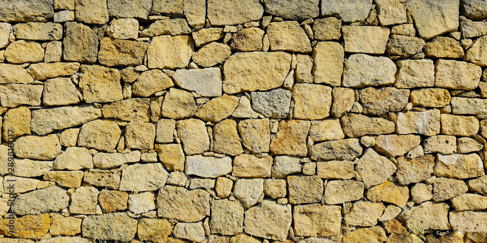  close up of wall of stone in the south of france