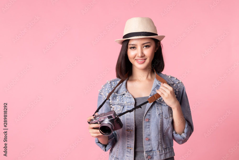Tourist woman in summer casual clothes.Asian Smiling woman .Passenger traveling abroad to travel on pink background.Asian woman going to summer vacation.Travel trip funny. Tourist woman in summer casual clothes.Asian Smiling woman .Passenger traveling abroad to travel on pink background.Asian woman going to summer vacation.Travel trip funny.