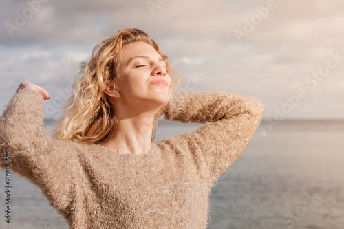 Happy woman outdoor wearing jumper