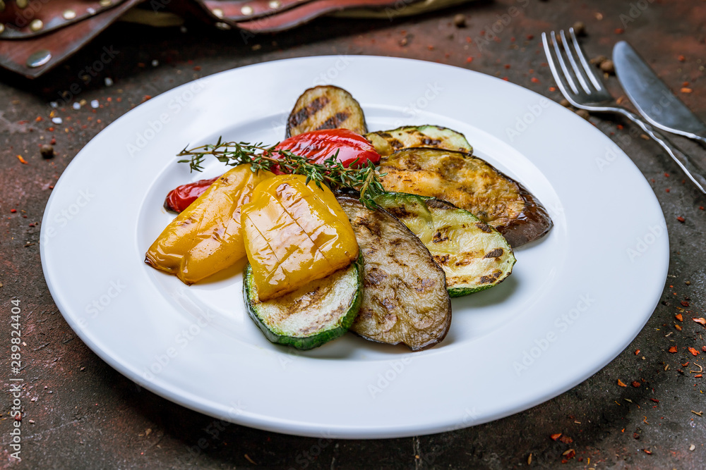 grilled vegetables on a plate on dark concrete rustic table grilled vegetables on a plate on dark concrete rustic table