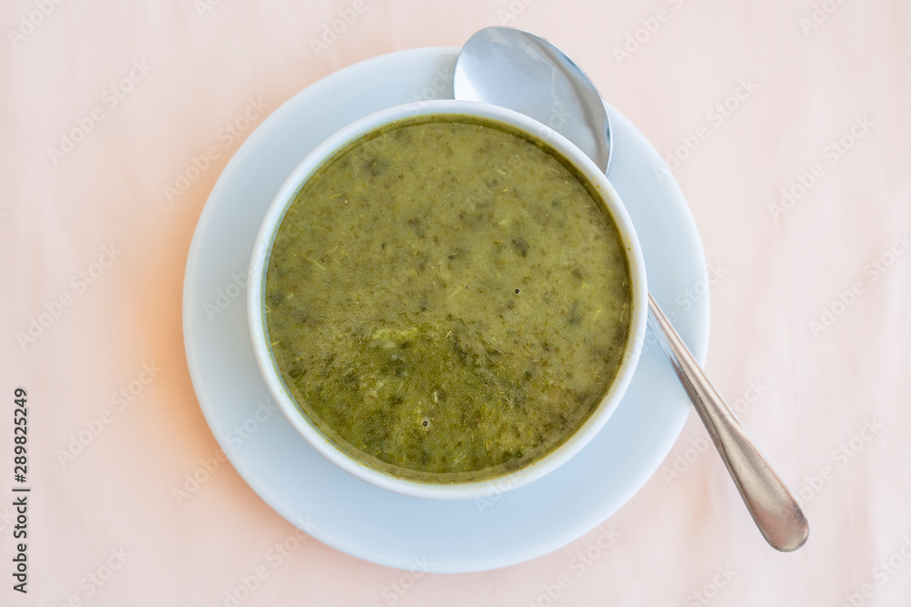 Green cream soup from spinach, close up